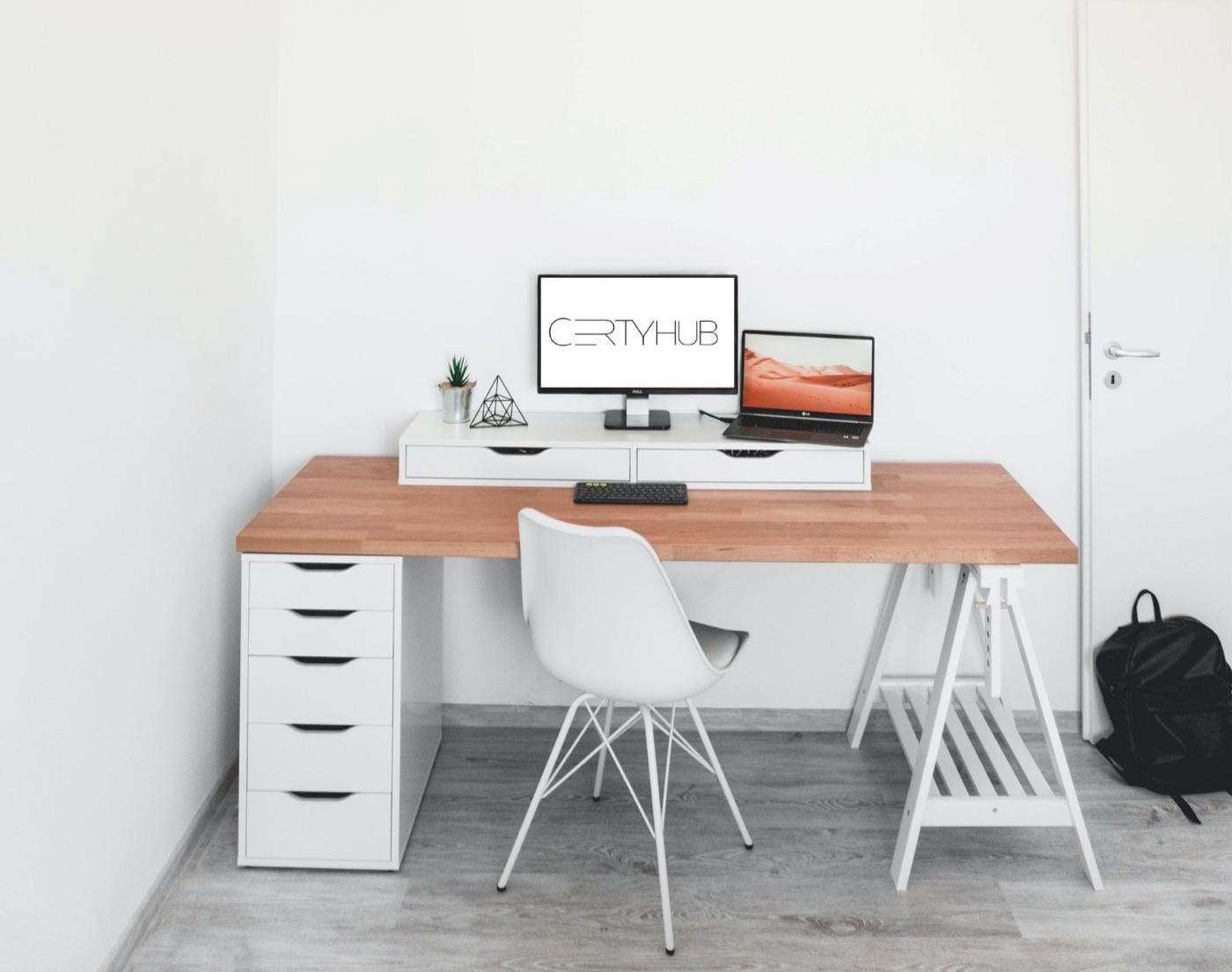 Desk with a computer showing the CertyHub logo